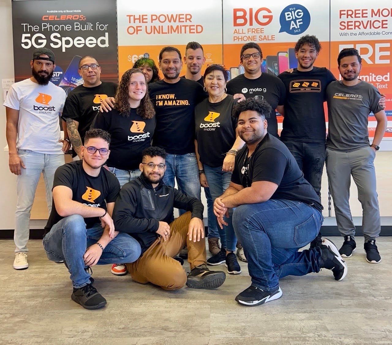 The full RB First Connect store team together in front of the Boost Mobile displays
