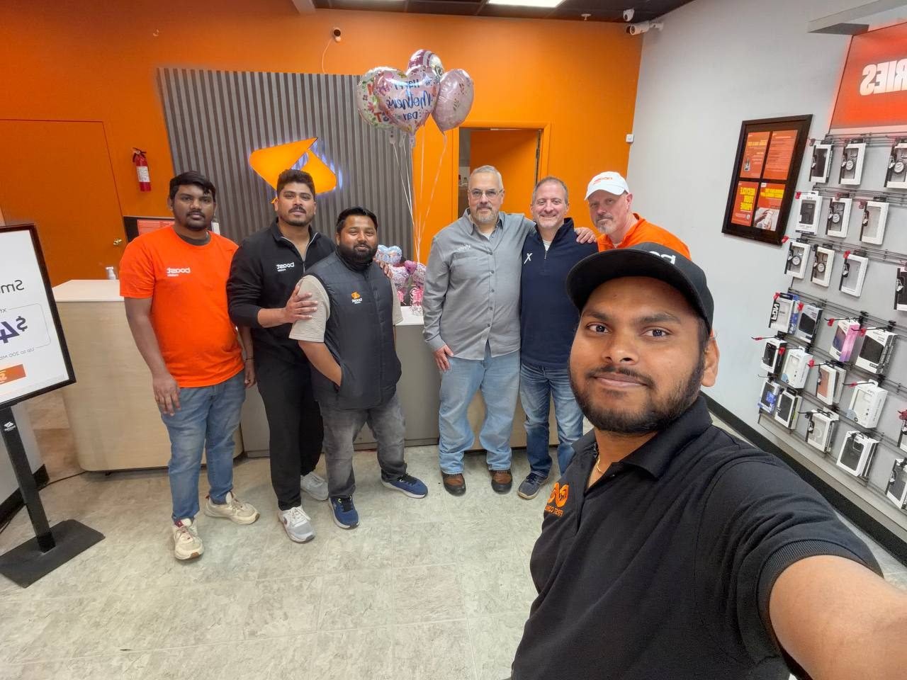 The RBFC crew together inside a Boost Mobile store